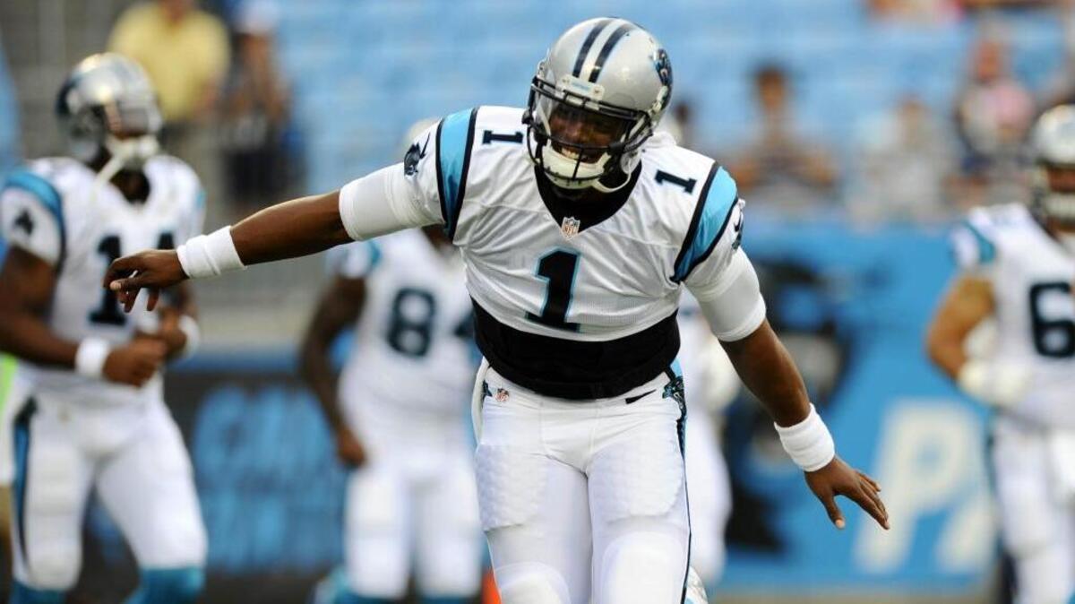 Carolina Panthers quarterback Cam Newton (1) runs onto the field prior to playing the New England Patriots at Bank of America Stadium.