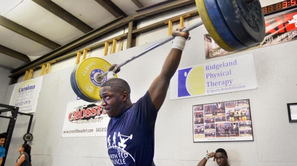 CJ Cummings lifts 150 kilos at CrossFit Beaufort during his daily workout on April 4, 2016 as he prepares for the Olympic trials in May.