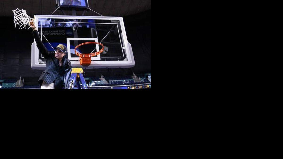 
Coach Dawn Staley cuts the net Sunday after defeating Florida State to get into the Final Four women’s basketball tournament in Tampa.
