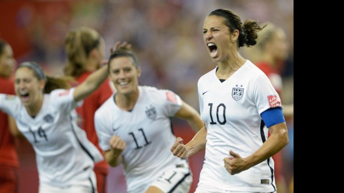 
Carli Lloyd (10) of the United States celebrates with teammates Ali Krieger (11) and Morgan Brian after scoring on a penalty kick against Germany during the second half of a semifinal in the Women's World Cup on Tuesday.
